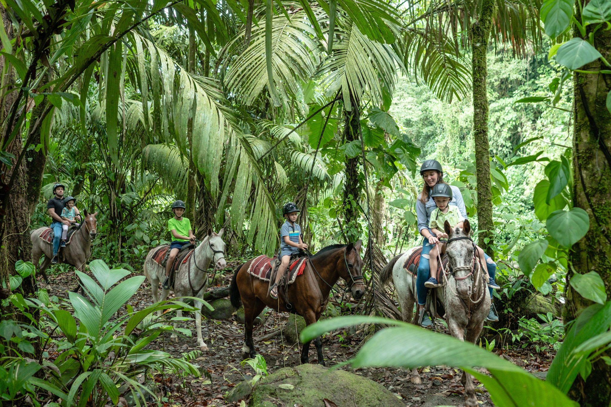 Family horseback riding from The Springs Resort